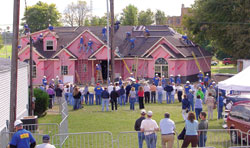 Workers help the new home of Steven and Shawna Farina of St. Meinrad begin to take shape. Volunteers turned out in large numbers to assist with the “Extreme Makeover: Home Edition” project.