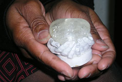 This ceramic creation of two small hands cupped together holding a glass heart is one of LaTonya Turner’s most treasured possessions. 