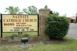 The parish family at Nativity of Our Lord Jesus Christ Parish in Indianapolis uses their church sign to extend congratulations to newly ordained Fathers Jeremy Gries and John Hollowell, who both grew up in the Indianapolis South Deanery parish. (Photo by Mary Ann Wyand) 