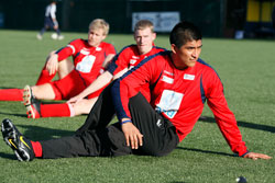 Archdiocesan seminarian Martin Rodriguez stretches before the start of a Feb. 27 match in the Clericus Cup, a soccer tournament in Rome in which priests and seminarians from around the world compete against each other. (CNS/Photo by Paul Haring)