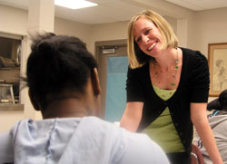 As the director of community and youth services at Holy Family Shelter in Indianapolis, Emily Able often brings a smile and caring touch to her efforts to help homeless children and their parents build a new life of hope. (Photo by John Shaughnessy)