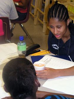 Making math fun for homeless children who temporarily live at Holy Family Shelter in Indianapolis is the goal of Lillian Sanders, a tutor for the Indianapolis Algebra Project and a junior at Marian University in Indianapolis. (Photo by John Shaughnessy)