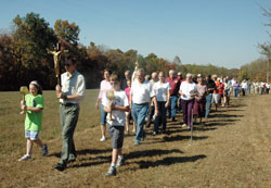 Pilgrims pray the rosary on Oct. 10 during a procession in a field in front of the Shrine of Our Lady of Monte Cassino in St. Meinrad. The shrine is located on top of a large hill outside the town, and was built by the monks of Saint Meinrad Archabbey in the early 1870s. (Photo by Sean Gallagher)