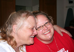 In a moment of pure joy, Roni Carroll, left, of St. Thomas Aquinas Parish in Indianapolis embraces Heather Neuroth, the daughter that Carroll placed for adoption nearly 35 years ago. The mother and daughter were reunited for the first time on Palm Sunday weekend in Indianapolis. (Submitted photo)