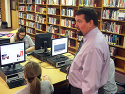 As the principal of Father Thomas Scecina Memorial High School in Indianapolis, John Hegarty always makes students the priority. Here, he interacts with Scecina students. (Photo by Chad Tuley)