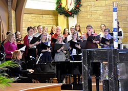 A choir sings during the New Albany Deanery Catholic Youth Ministries 50th jubilee Mass at Our Lady of Perpetual Help Church in New Albany on Jan. 11. (Photo by Natalie Hoefer)