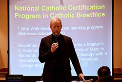 Father Tad Pacholczyk, director of education at the National Catholic Bioethics Center in Philadelphia, discusses end-of-life decisions during his Feb. 14 presentation at St. John Paul II Parish’s St. Paul campus in Sellersburg. (Photo by Leslie Lynch)