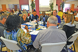 Catholics of different ethnicities from around central and southern Indiana discuss questions in small groups during the V Encuentro event at St. Andrew the Apostle Parish in Indianapolis on Sept. 30. (Photo by Natalie Hoefer)