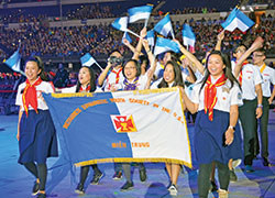 Youths and adult chaperones of the Vietnamese Eucharistic Youth Society in the U.S.A. process into Lucas Oil Stadium in Indianapolis on Nov. 16 for the opening session of the National Catholic Youth Conference. (Photo by Natalie Hoefer)