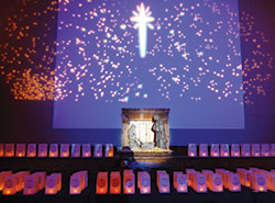 The Christmas Star overlooks luminarias surrounding a Nativity scene during the Dec. 7 “An Evening of Lights” program at the Archbishop Edward T. O’Meara Catholic Center in Indianapolis. (Photo by Mike Krokos)