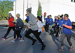 Members of the Race for Vocations team begin a 5K on May 8 at St. Michael Parish in Greenfield. The event was held in person this year after a one-year hiatus due to the coronavirus pandemic. (Photo by Sean Gallagher)