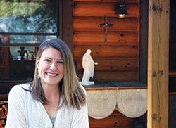 Photo: After a whirlwind journey of adventures, Tekla Bedwell has come home to live in a log cabin in Indianapolis where she has been able to draw closer to God and her family. (Photo by John Shaughnessy)