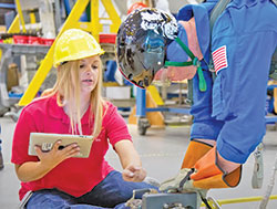 Known as the “Professor of Spacewalking,” Allissa Battocletti Noffke helps train an astronaut in using the tools that are needed during a space mission. (Submitted photo)