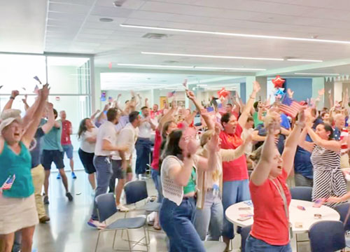 In a “watch party” at Cathedral High School in Indianapolis on August 6, fans celebrate the gold-medal victory of Cole Hocker, a 2019 Cathedral grad, in the 1500-meter run in the 2024 Olympics in Paris. (Submitted photo)