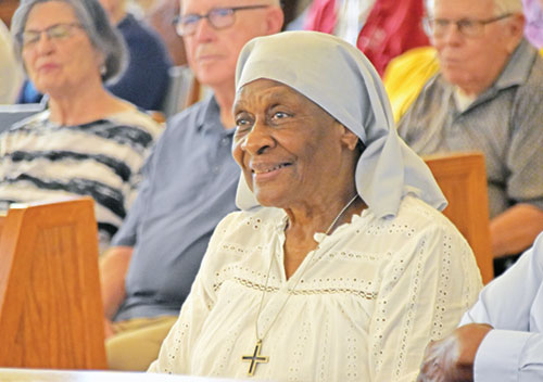 Sister Demetria Smith smiles during a Mass on Aug. 17 in the St. Augustine Home for the Aged chapel in Indianapolis honoring her 70th jubilee as a member of the Missionary Sisters of Our Lady of Africa. (Photo by Natalie Hoefer)